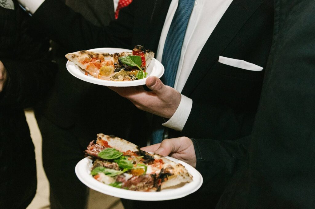 Party guests enjoying pizza